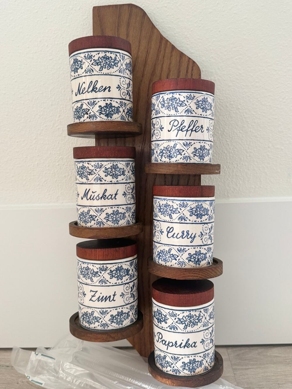 Vintage German spice jar set on wooden rack blue and white containers with lids
